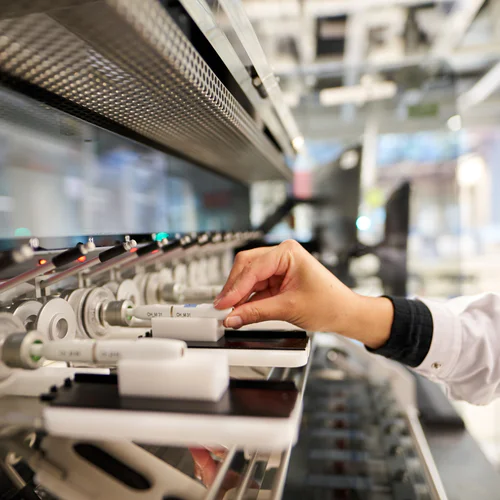 Scientist conducts research on a machine to evaluate a smoke-free device.
