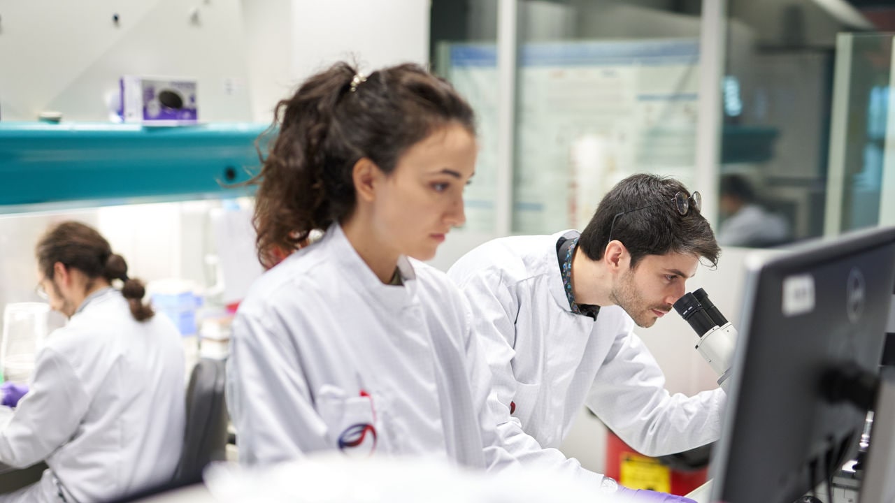 Scientists working in the PMI laboratory, Cube