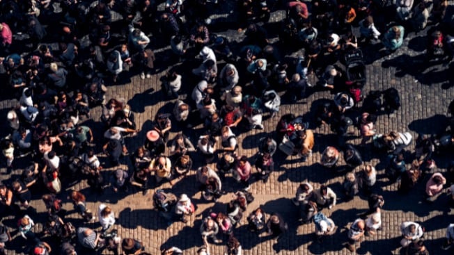 A large crowd of people on street square.